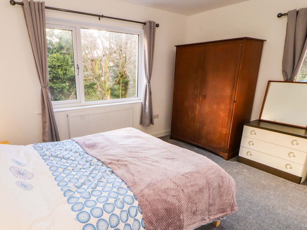 A bedroom with a bed and wardrobe at Westerlodge Threlkeld near Keswick