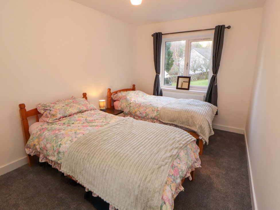 A bedroom with two beds and a window at Westerlodge Threlkeld near Keswick