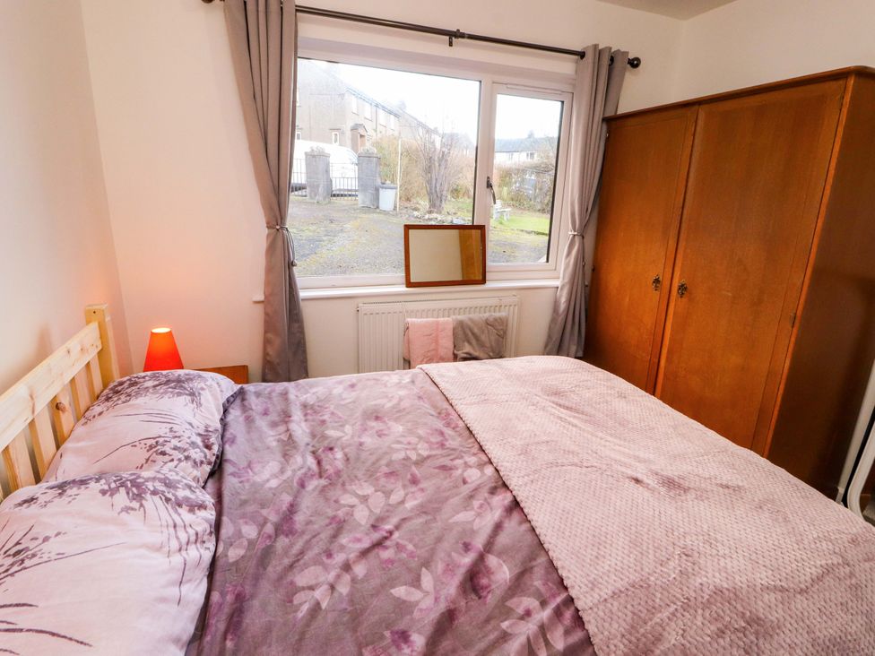 A bedroom with a bed and wardrobe at Westerlodge Threlkeld near Keswick