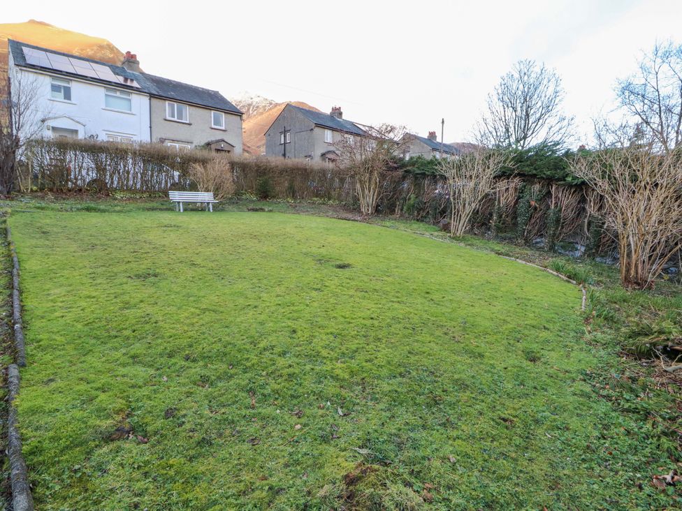 A garden with a bench and grass at Westerlodge Threlkeld near Keswick
