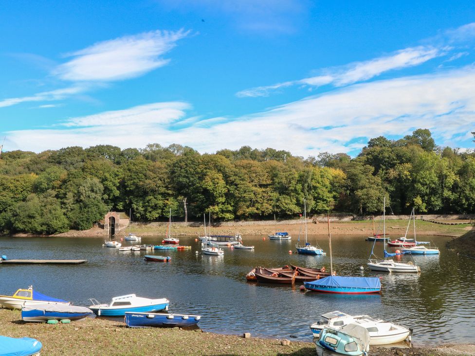 A view of boats on water surrounded by trees at Woodlands View in Leek