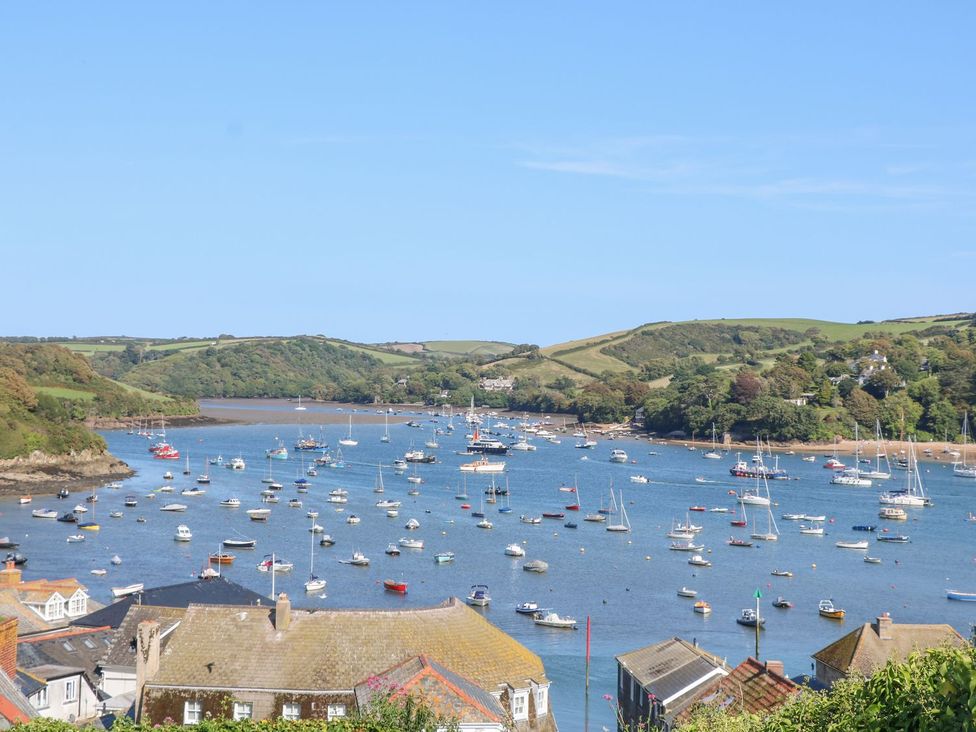 A view of boats in water with hills in the background at Quay cottage Salcombe