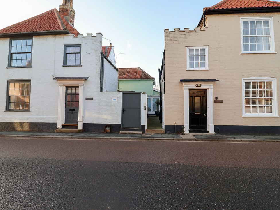 Two houses with doors and windows on a street at Nutshell in Aldeburgh