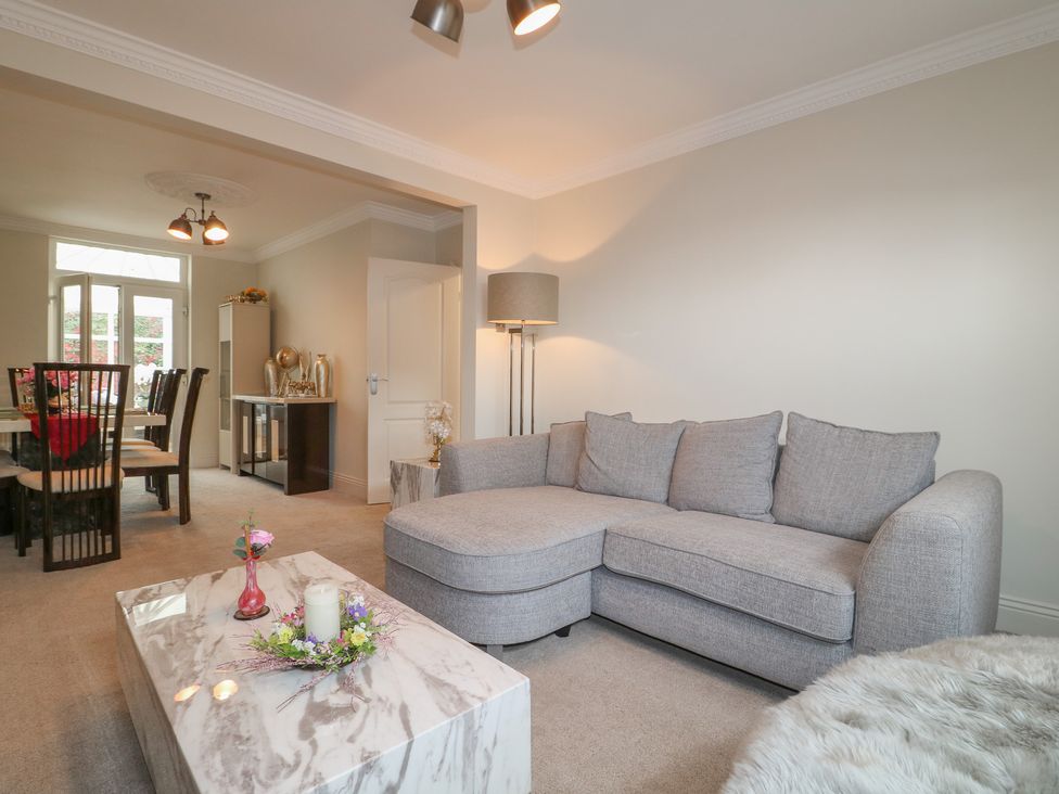 A living room with a sofa and coffee table at No.12 Alexandra Avenue in Sutton-in-Ashfield
