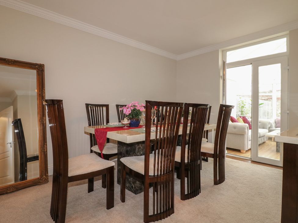 A dining room with a table and chairs at No.12 Alexandra Avenue Sutton-in-Ashfield
