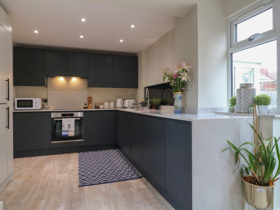 A kitchen with cabinets and appliances at No.12 Alexandra Avenue Sutton-in-Ashfield