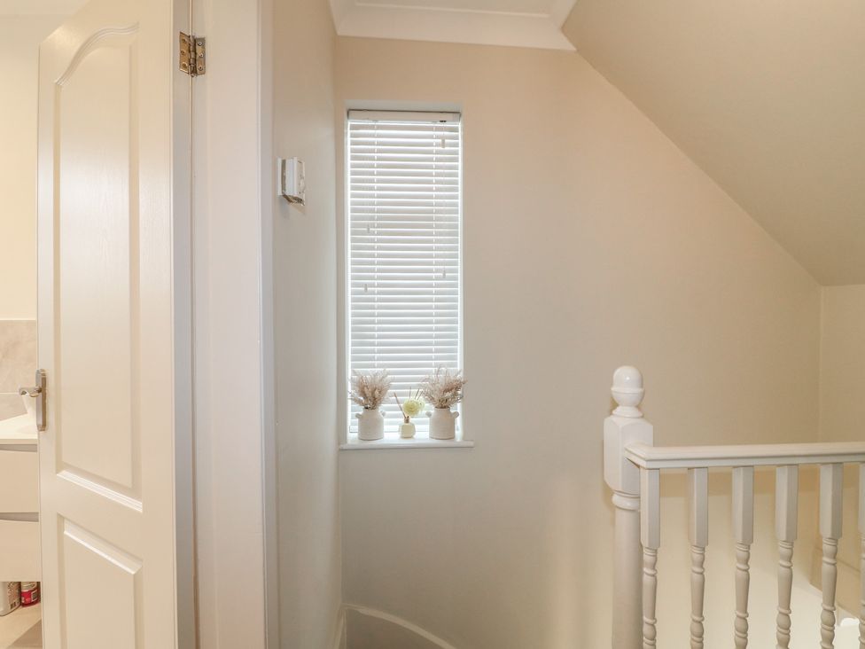 A landing with a window and staircase railing at No.12 Alexandra Avenue Sutton-in-Ashfield
