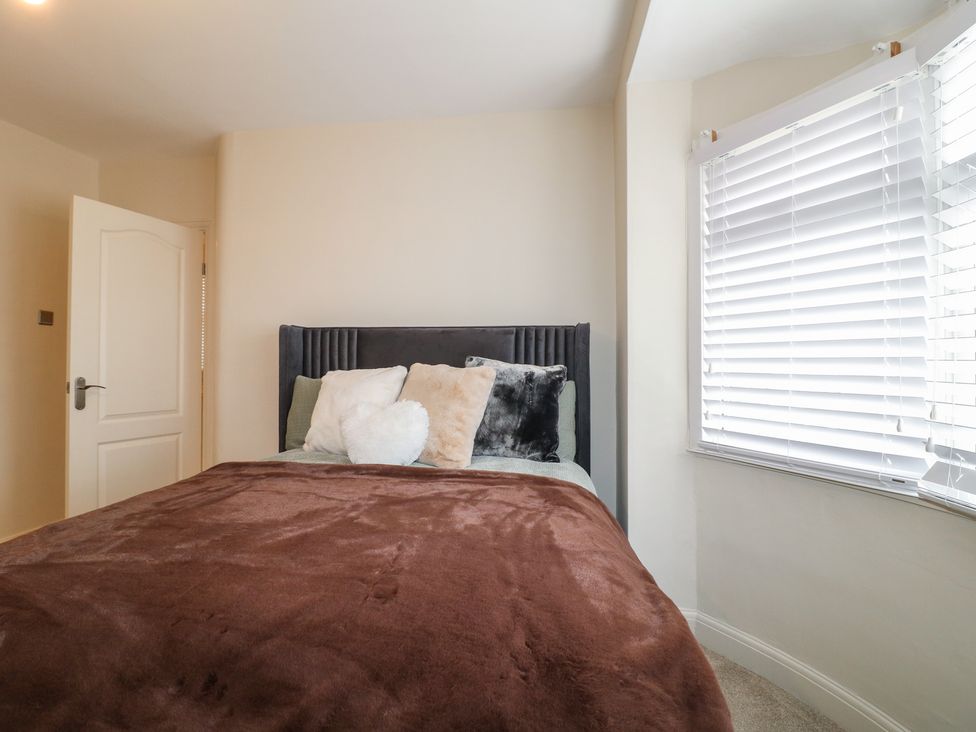 A bedroom with a bed and pillows at No.12 Alexandra Avenue Sutton-in-Ashfield