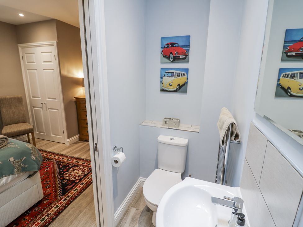 A bathroom with a toilet and sink at Lily Stables Black Bourton near Bampton, Oxfordshire