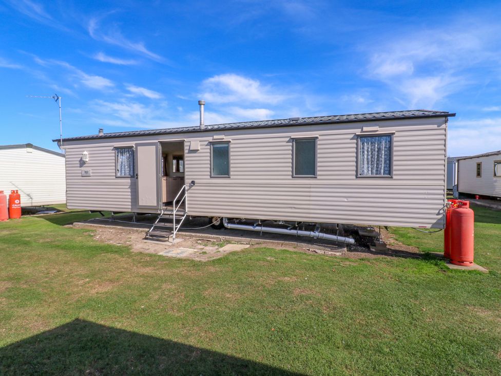 A caravan with steps and windows at Luisa Family Caravan St. Osyth