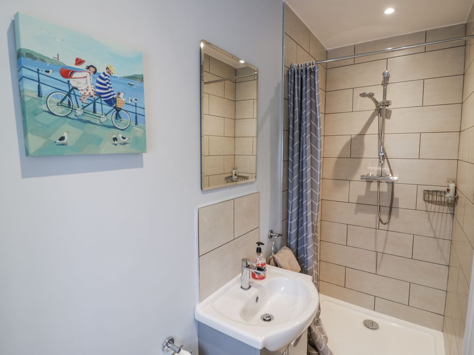 A bathroom with a shower and sink at Rose Stables in Black Bourton near Bampton