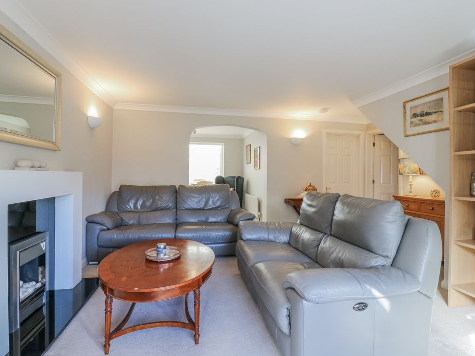 A living room with sofas and a coffee table at 32 Abbey Gardens