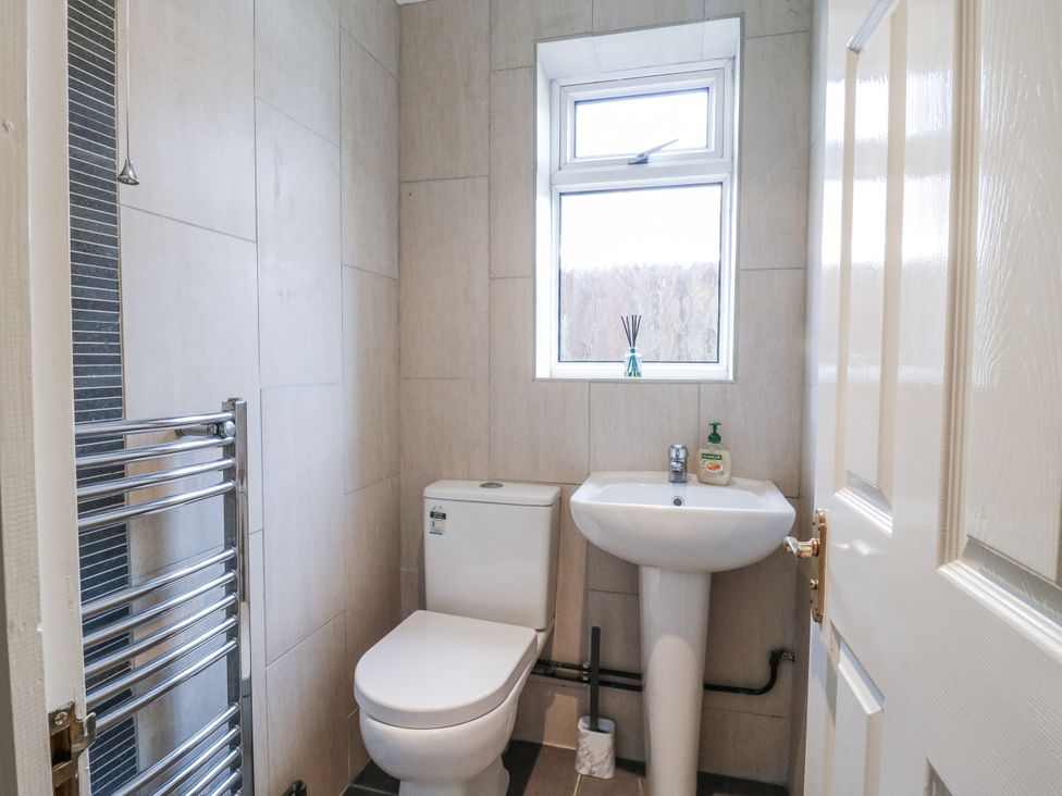 A bathroom with a toilet and sink at 32 Abbey Gardens