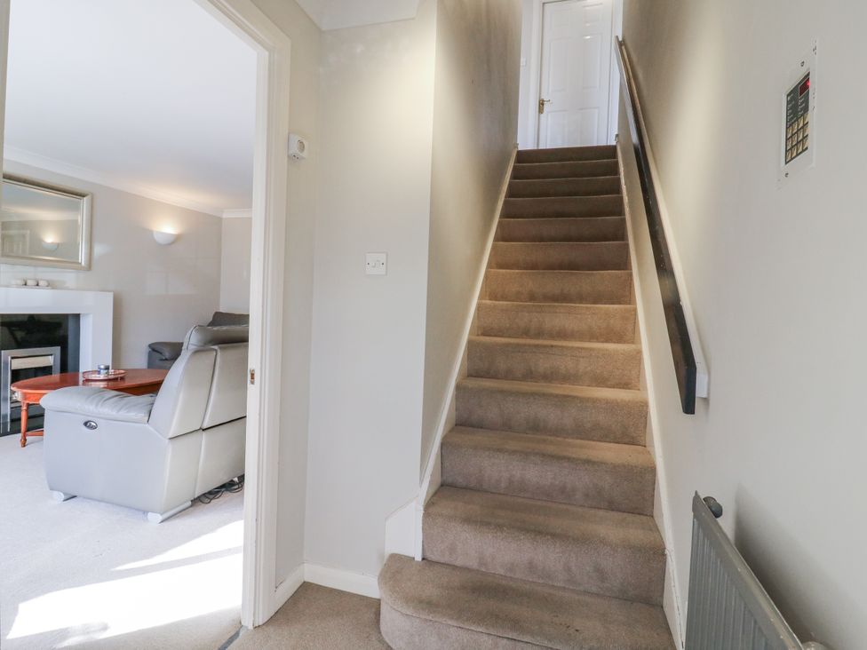 A staircase leading to an upper level in 32 Abbey Gardens