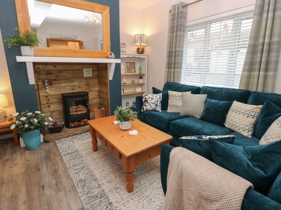 A living room with a sofa and coffee table at 57 Cockpit Hill Northallerton