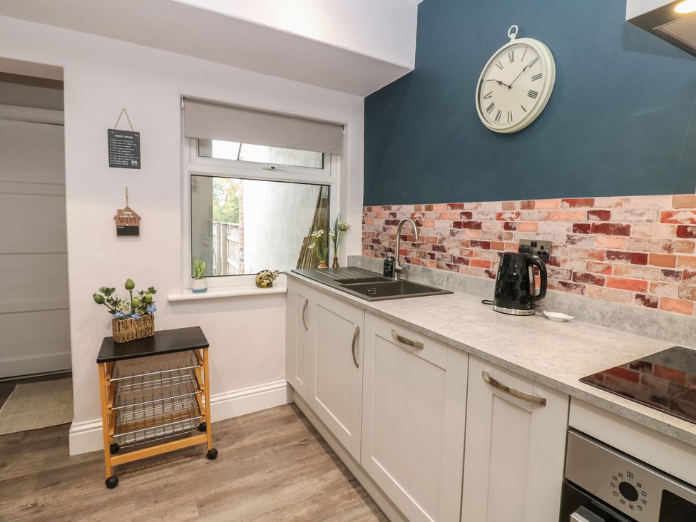 A kitchen with a sink and kettle at 57 Cockpit Hill in Northallerton
