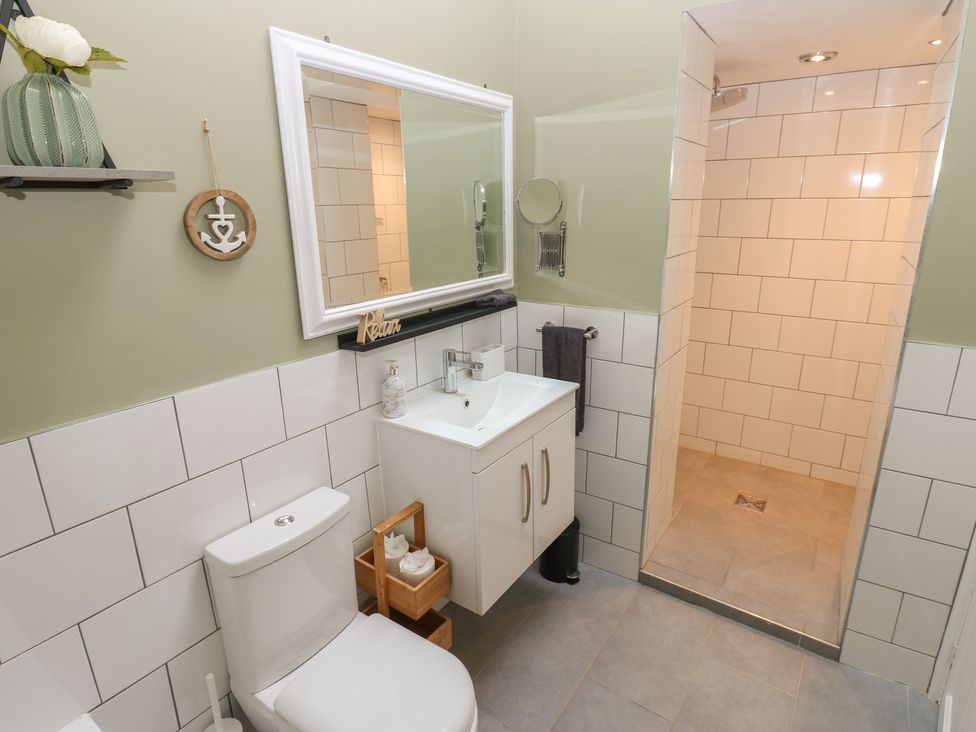A bathroom with a sink, toilet, and shower at 57 Cockpit Hill Northallerton