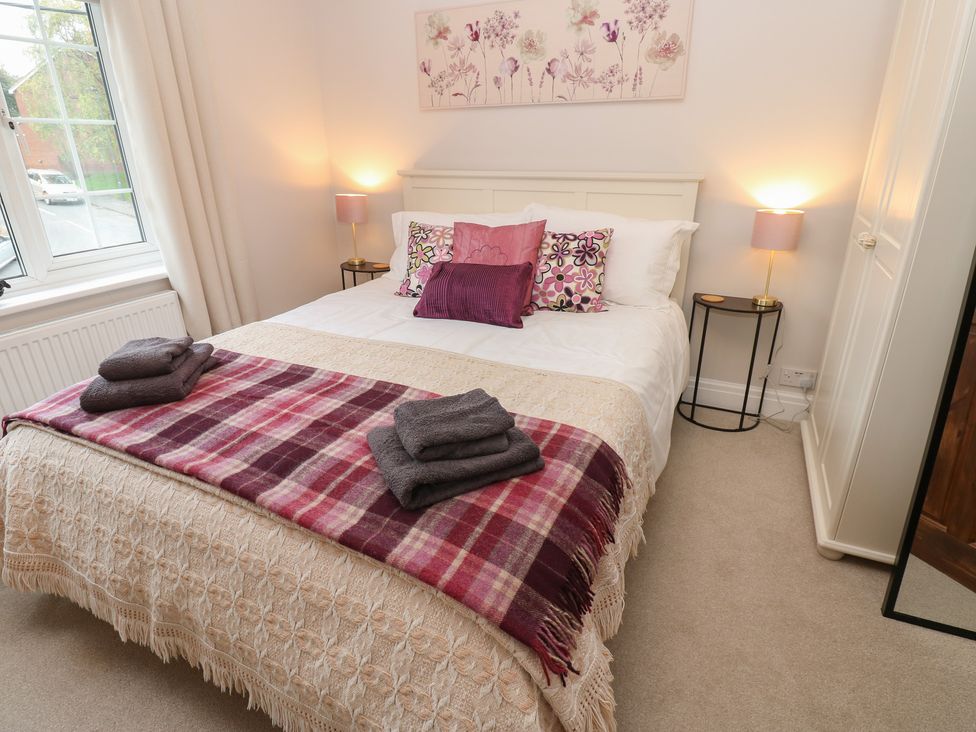 A bedroom with a bed and bedside tables at 57 Cockpit Hill Northallerton