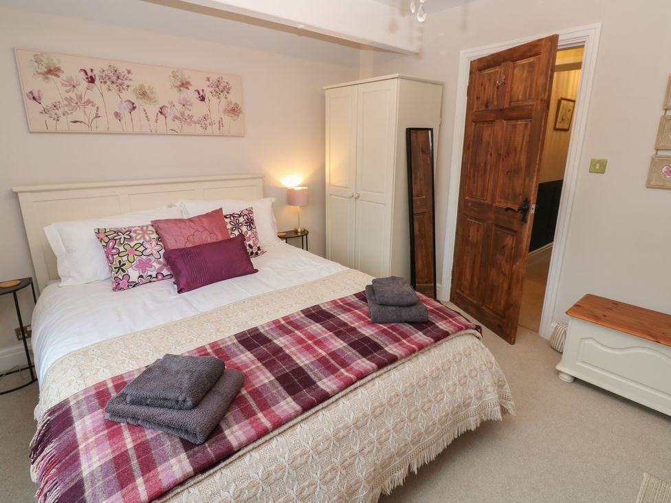 A bedroom with a double bed and a lamp at 57 Cockpit Hill Northallerton