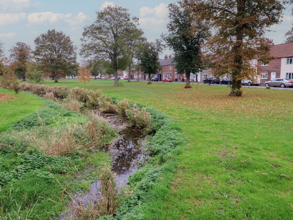 A park with a stream and trees at 57 Cockpit Hill Northallerton