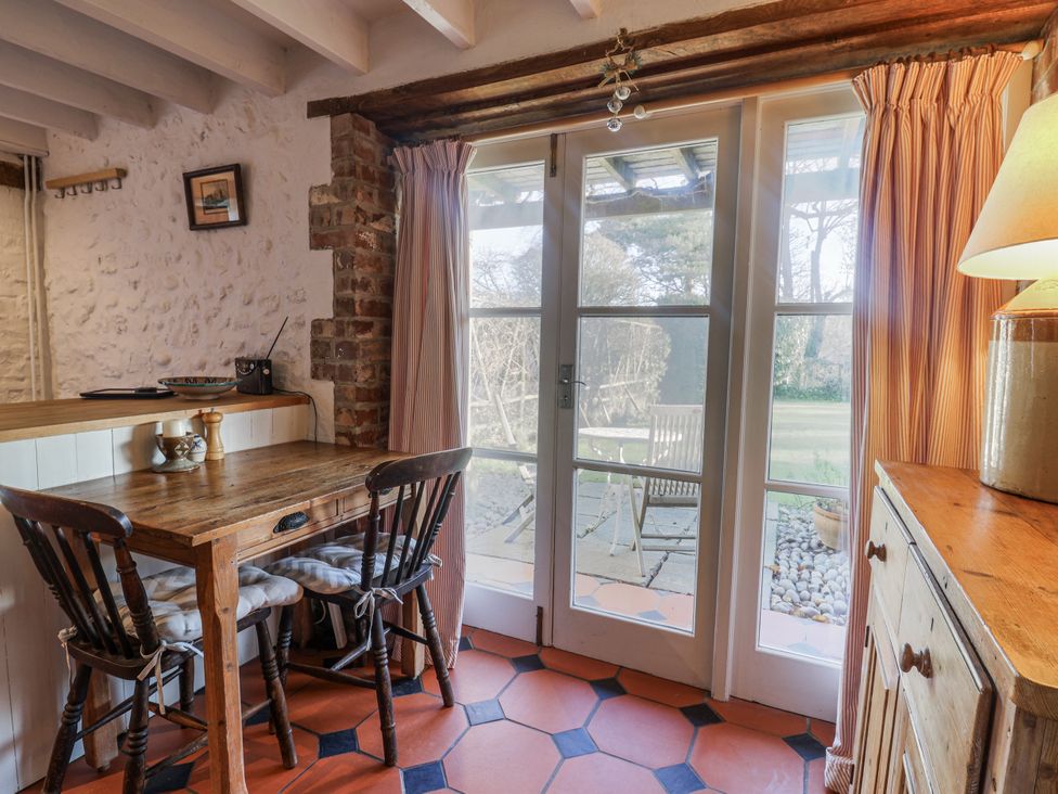 A dining area with a table and chairs at The Little Barn in Fluxton Nr. Ottery St Mary