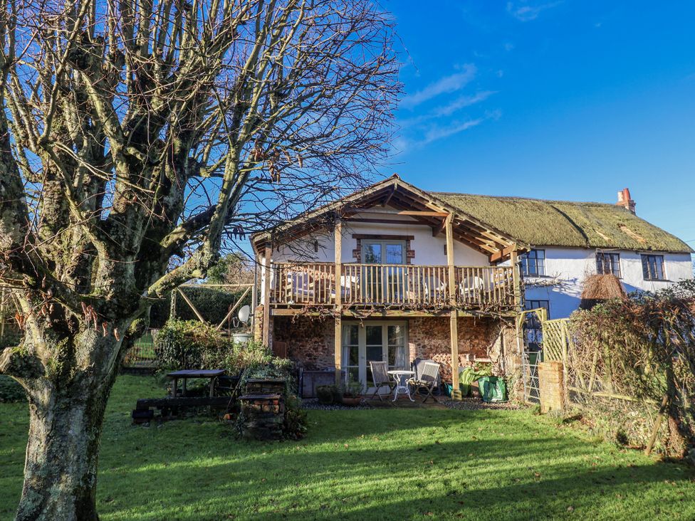 A house with a balcony and garden at The Little Barn Fluxton Nr. Ottery St Mary