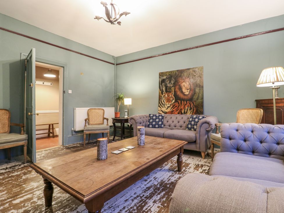 A living room with sofas and a coffee table at The Farmhouse in Whitchurch, Buckinghamshire