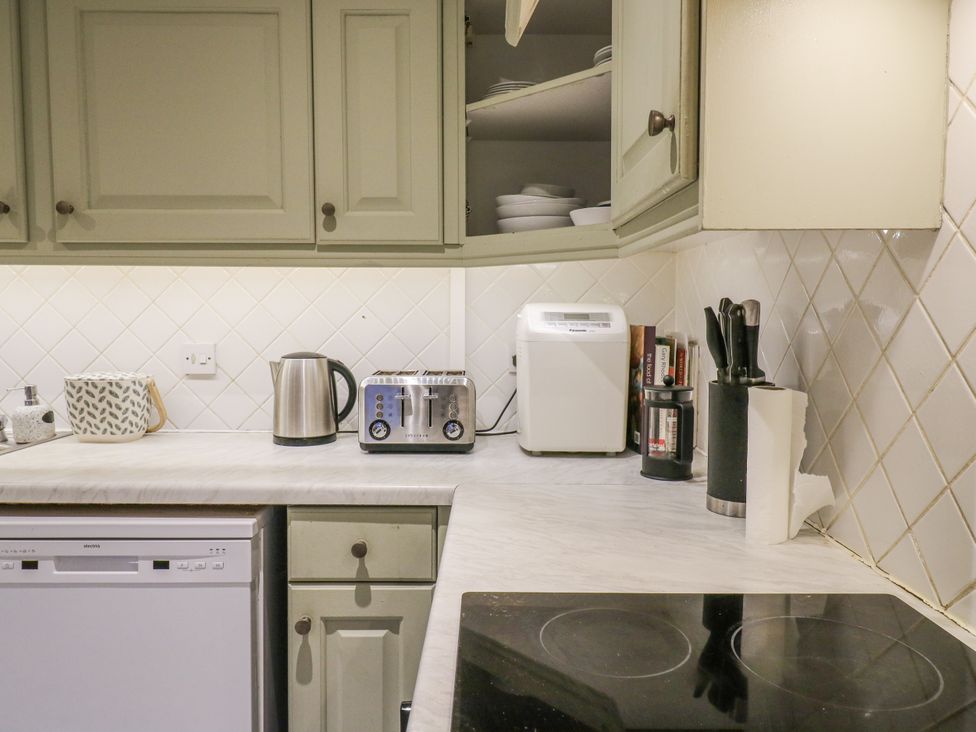 A kitchen with appliances and utensils at The Farmhouse in Whitchurch, Buckinghamshire