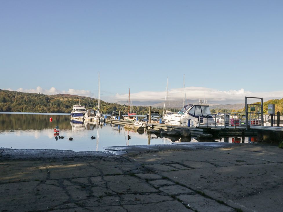 A dock with boats moored at 32 Grasmere in Windermere