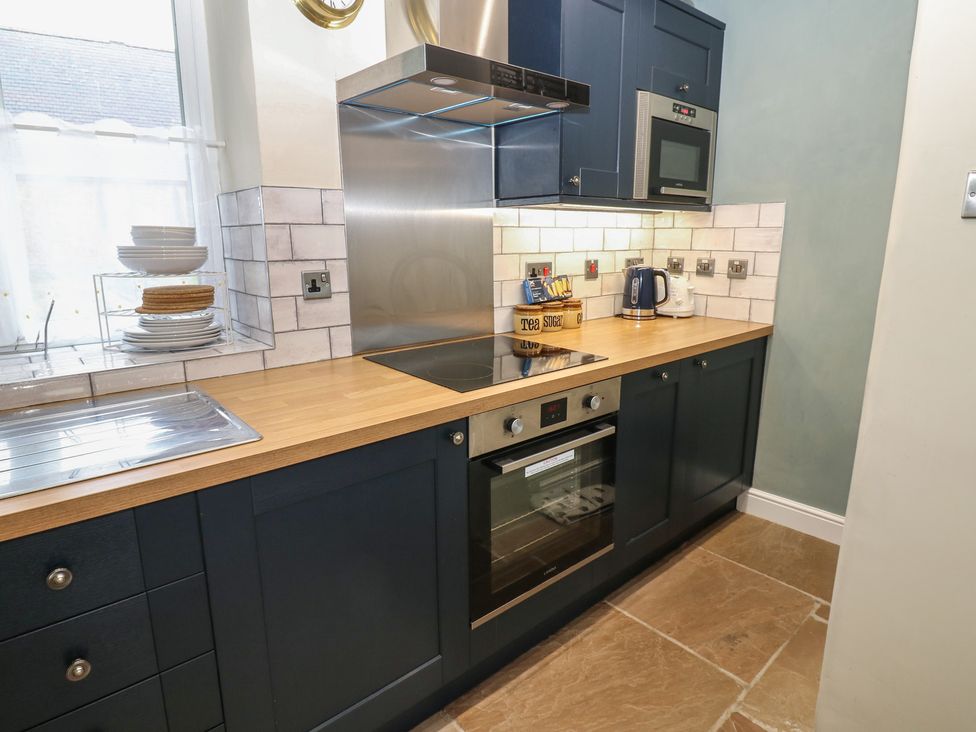 A kitchen with appliances and utensils at Tyg Cottage in Ripon
