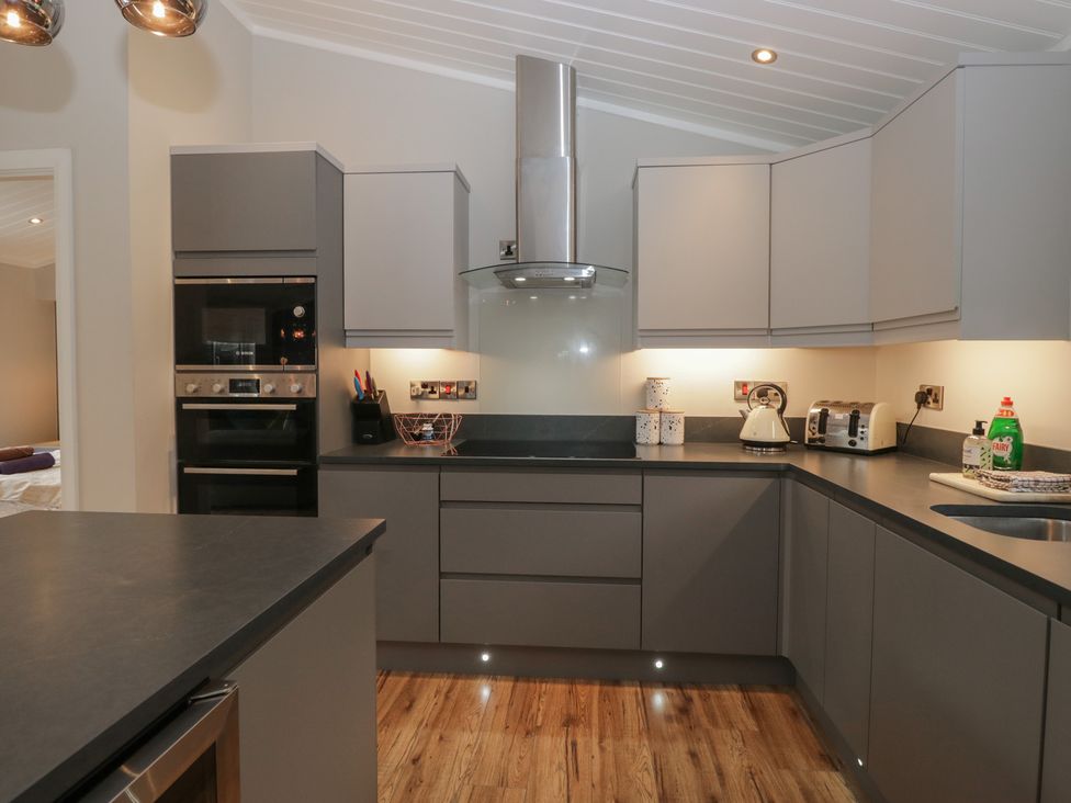 A kitchen with appliances and countertops at 7 Lake View in Windermere