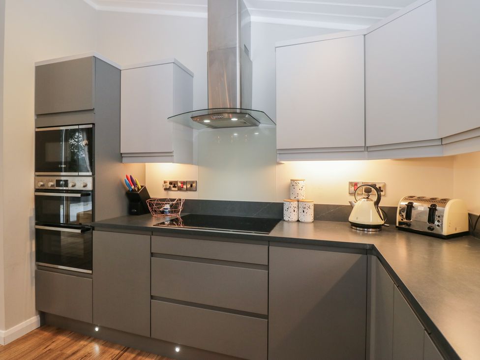A kitchen with appliances and storage at 7 Lake View in Windermere