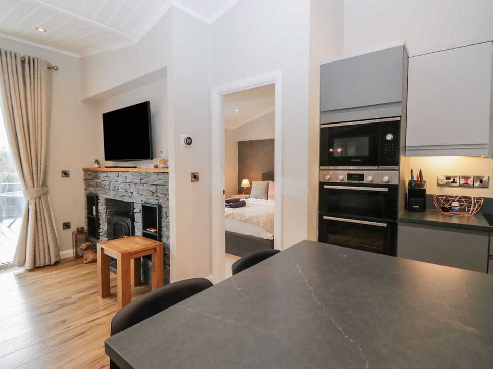A kitchen with a table and chairs at 7 Lake View in Windermere