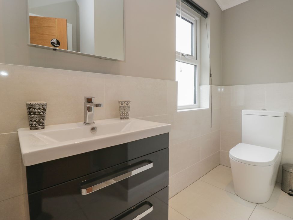 A bathroom with a sink and toilet at 7 Lake View in Windermere