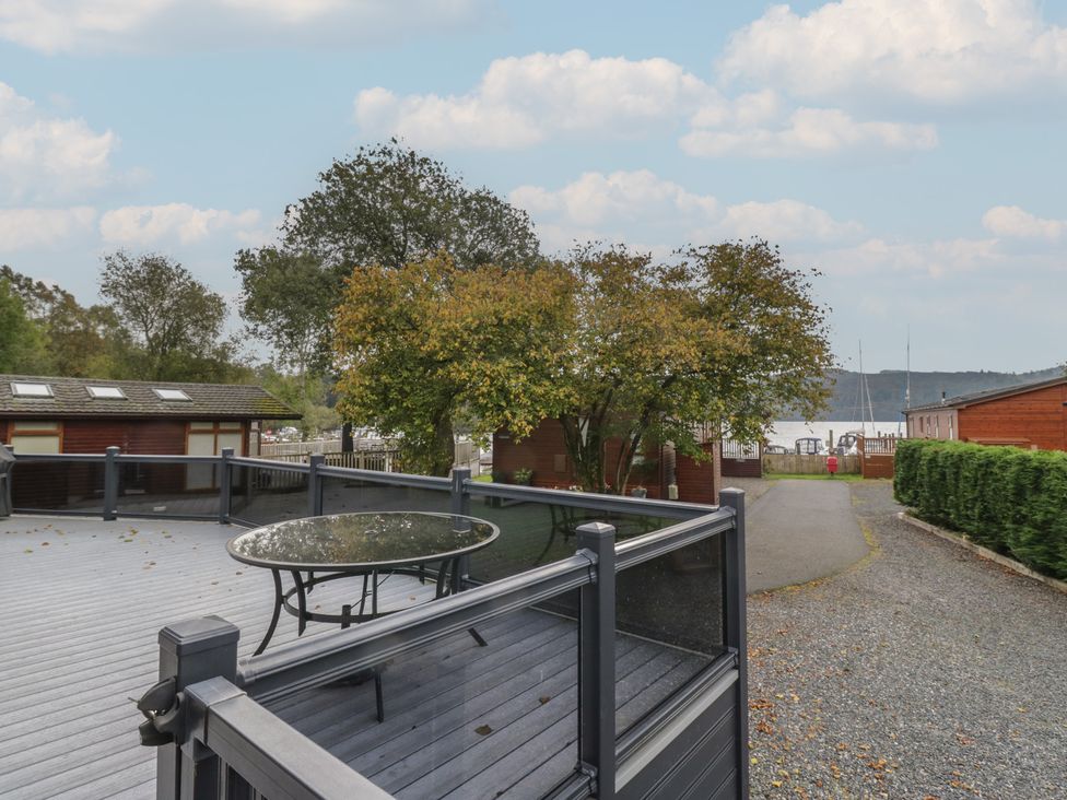 An outdoor area with a table and tree at 7 Lake View Windermere