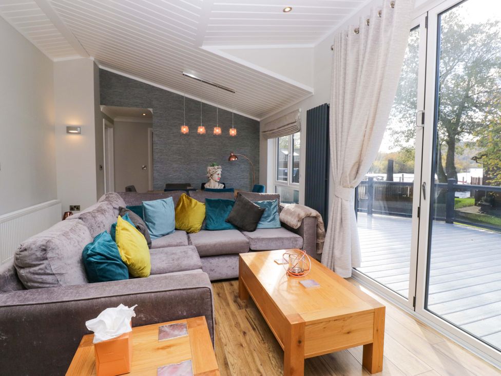 A living room with a sofa and coffee table at 7 Lake View, Lake View 7, White Cross Bay near Windermere