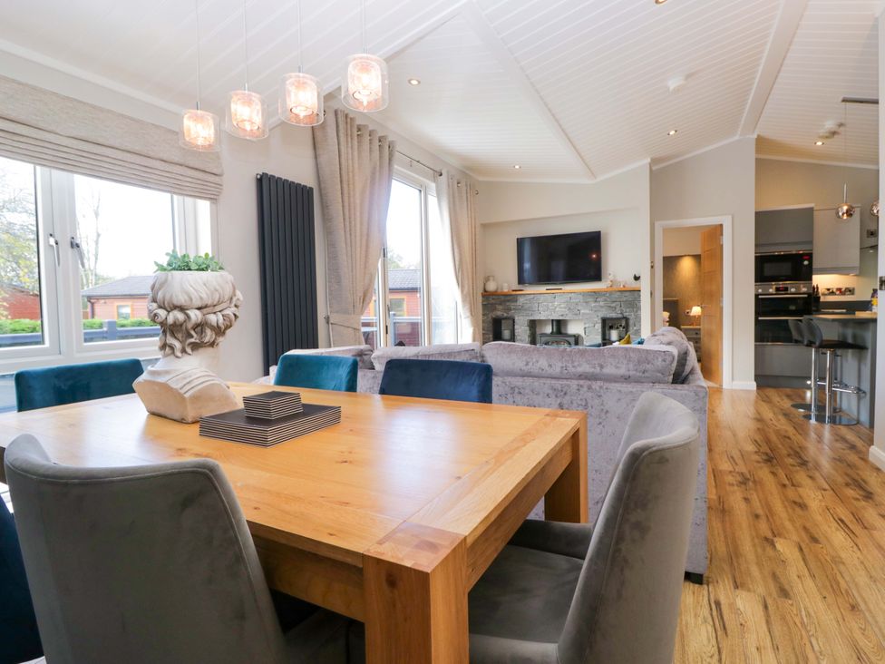 A dining room with a table and chairs at 7 Lake View, Lake View 7, White Cross Bay near Windermere