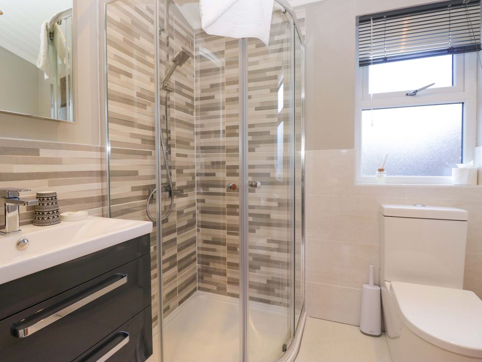 A bathroom with shower, toilet and sink at 7 Lake View, Lake View 7, White Cross Bay near Windermere