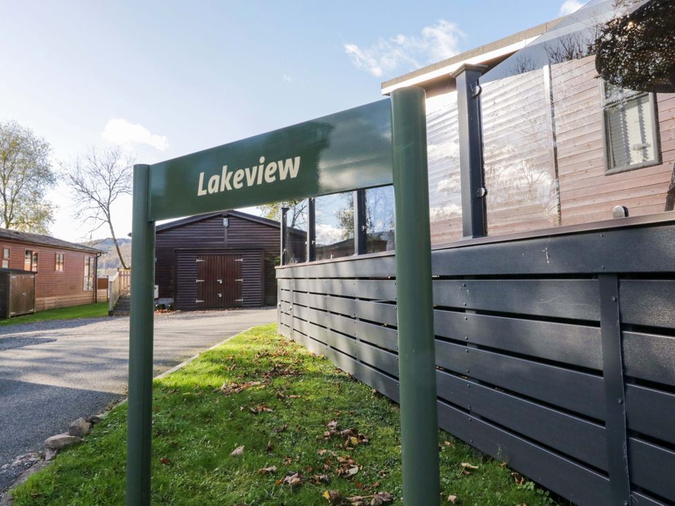 A sign labeled Lakeview near wooden cabins at 7 Lake View, Lake View 7, White Cross Bay near Windermere