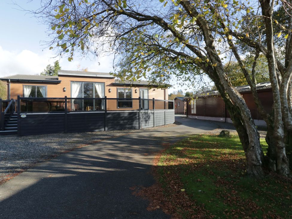 A house with a deck and windows at 7 Lake View, Lake View 7, White Cross Bay near Windermere