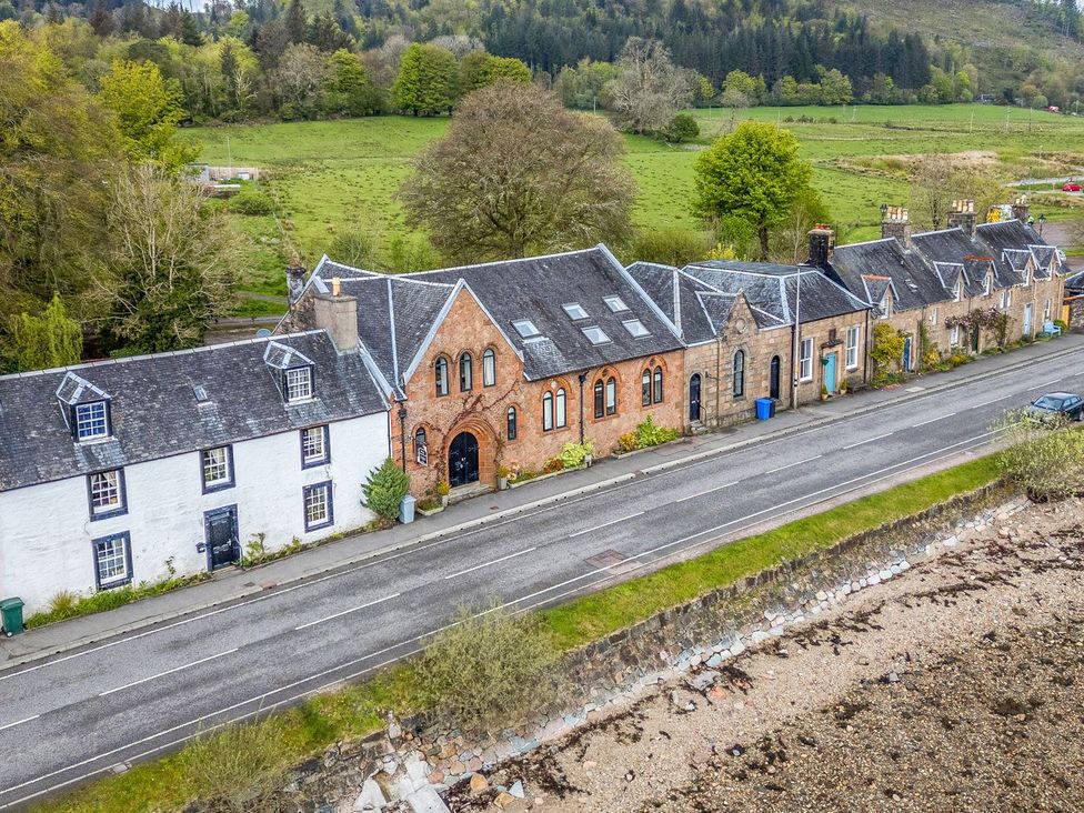 A row of houses along a road at Newton Hall in Inveraray