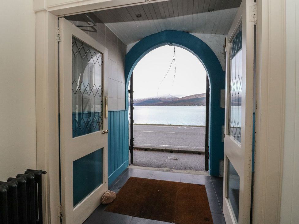 An entrance hallway with a view of the water at Newton Hall in Inveraray