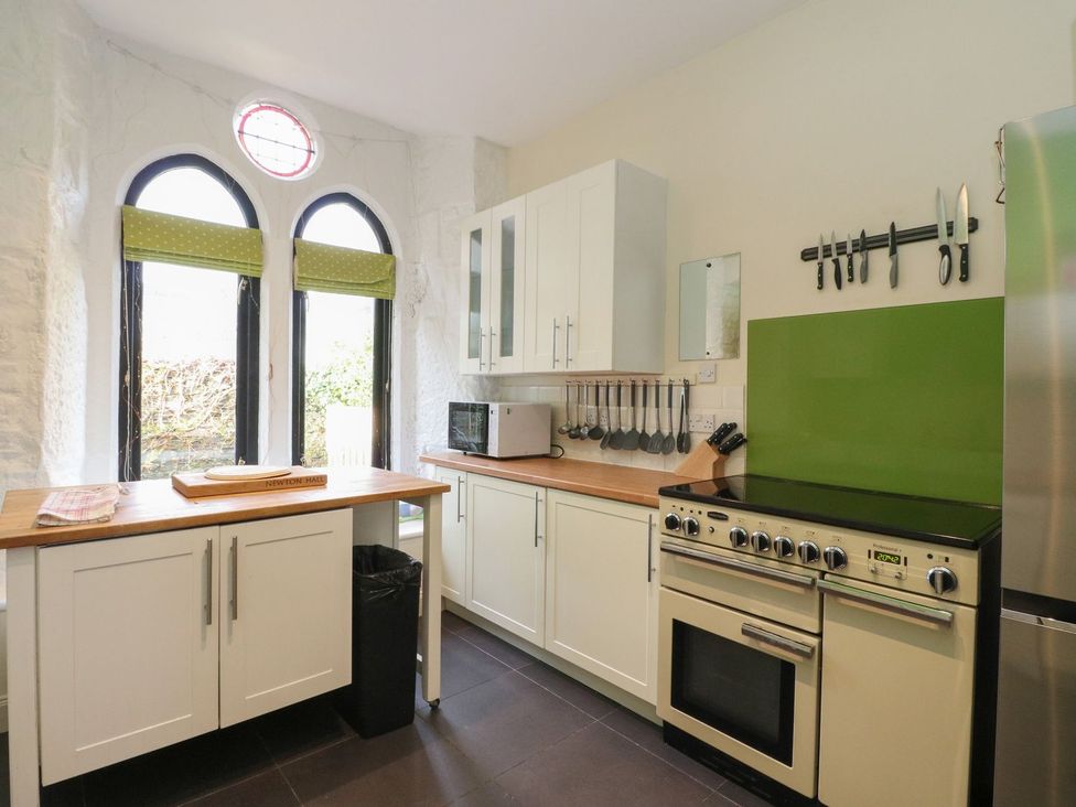 A kitchen with a stove and cabinets at Newton Hall in Inveraray