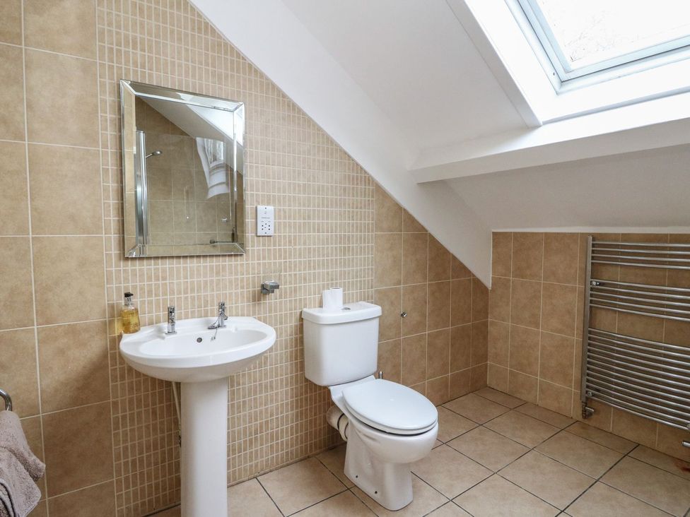A bathroom with sink and toilet at Newton Hall in Inveraray