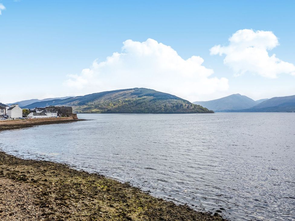 A view of mountains and water at Newton Hall in Inveraray