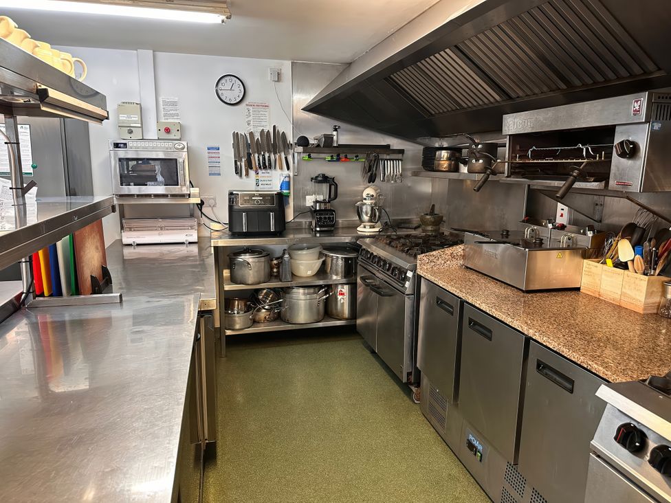 A kitchen with cooking appliances and utensils at Jabajak in Whitland