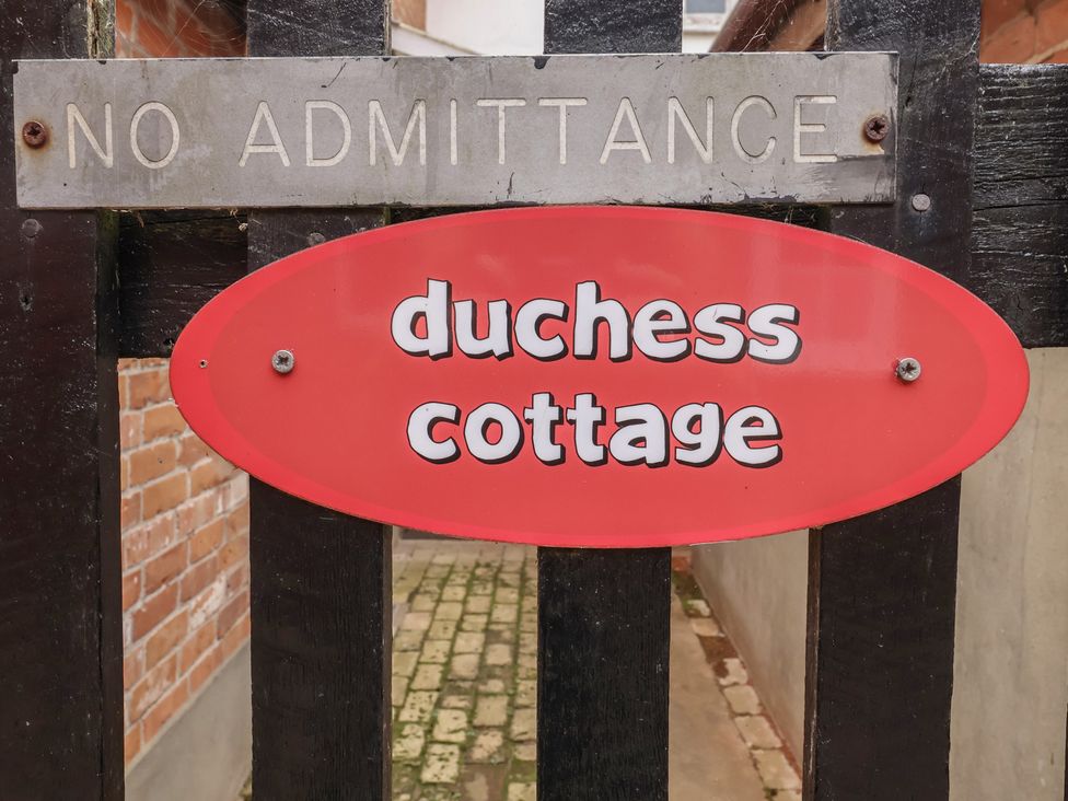 Sign indicating duchess cottage at outdoor entrance