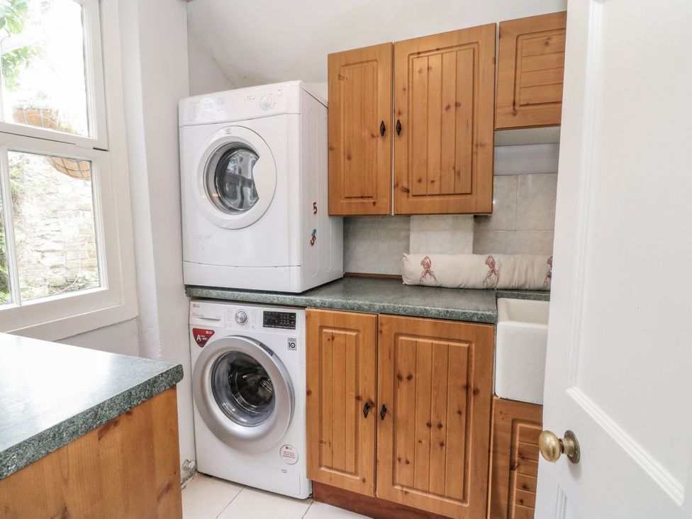 A laundry room with a washing machine and dryer at Rowan Tree House in Brechin