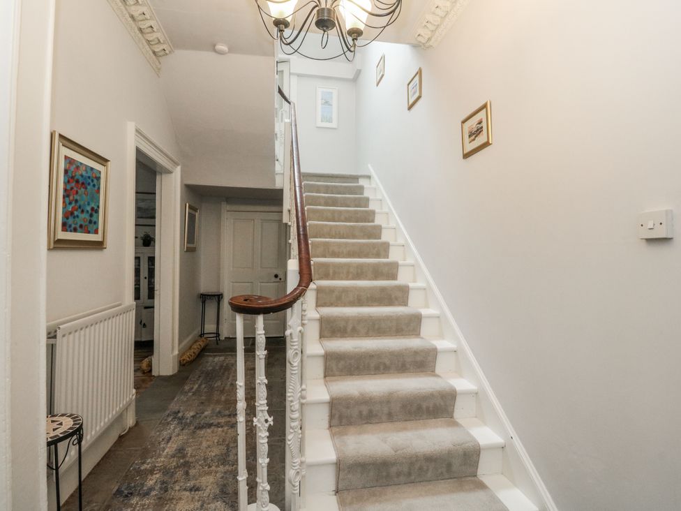 A staircase in a hallway at Rowan Tree House in Brechin