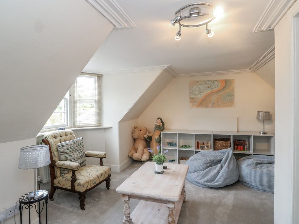 A snug with seating and storage at Rowan Tree House in Brechin